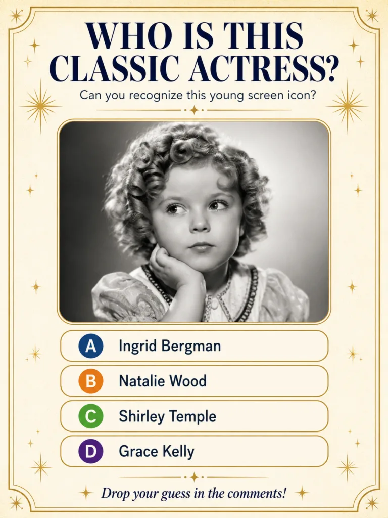 A black and white photo of a very young Shirley Temple smiling and looking adorable with her signature curly hair