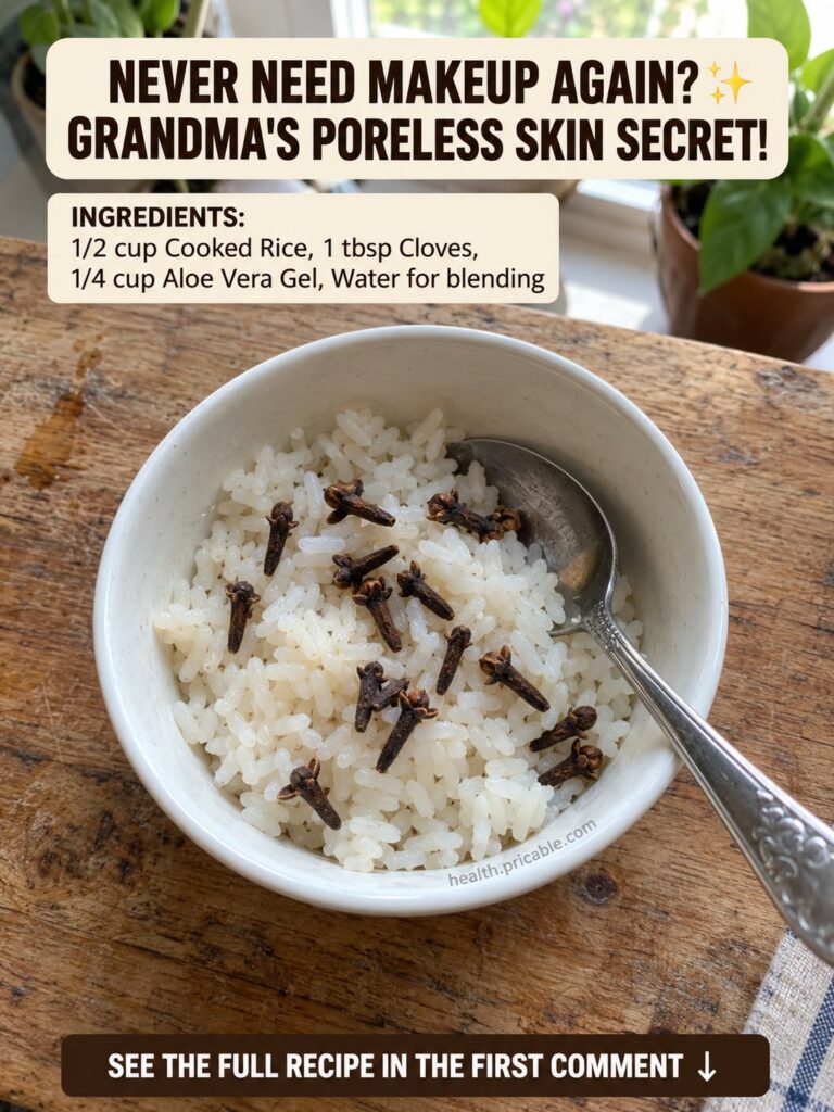 A close-up of a DIY rice and clove face mask mixture in a small bowl with a wooden spoon surrounded by loose rice grains