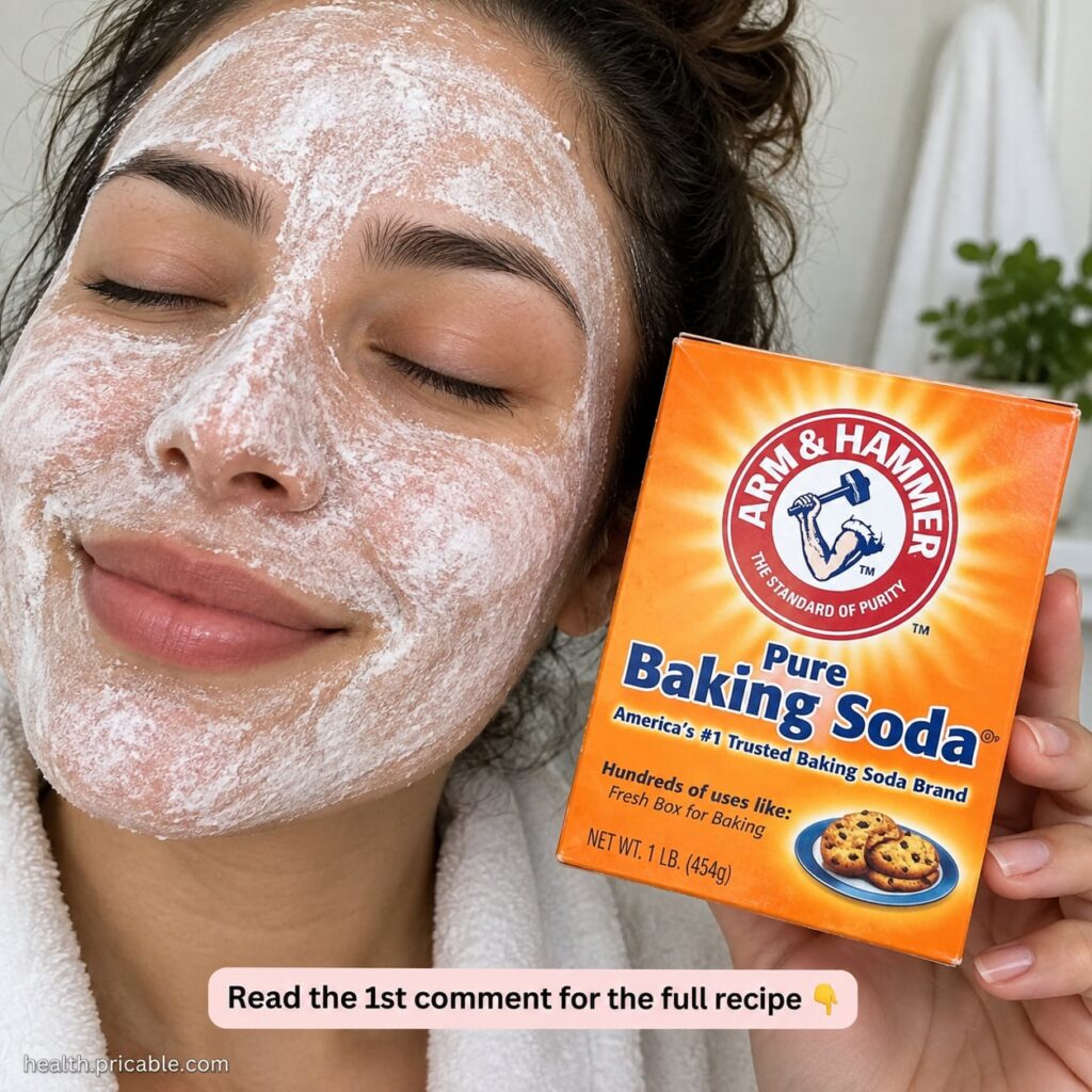 A close-up of a small bowl with baking soda being mixed with water to form a paste with a spoon