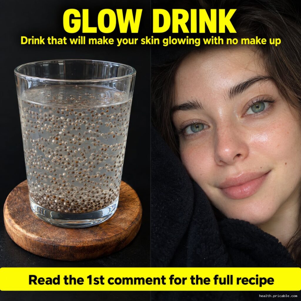 A refreshing glass of a yellow-orange glow drink with a slice of lemon and fresh ginger set against a bright natural bac