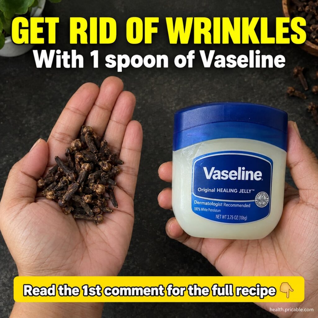A small glass jar of homemade Vaseline and clove balm with a few whole cloves and a jar of petroleum jelly in the backgr