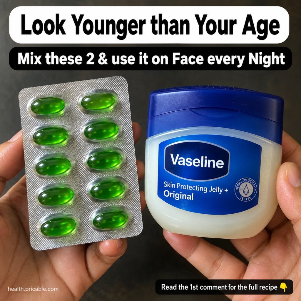 A small glass jar of a homemade Vaseline-based balm with a smooth glossy texture placed on a softly lit vanity with a vi