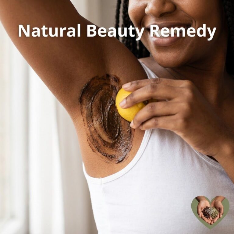 A close-up of a person applying a homemade lemon and baking soda paste to their underarm with fresh lemons and a bowl of