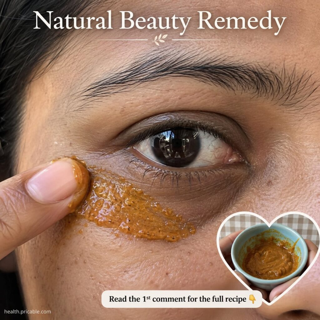 Ingredients for a natural under-eye remedy a raw potato a jar of aloe vera gel and a small bottle of almond oil on a rus