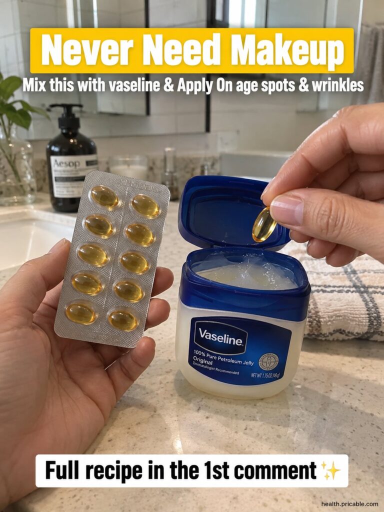 A small clear glass jar filled with a creamy pale mixture of Vaseline and a light powder with a finger gently scooping o