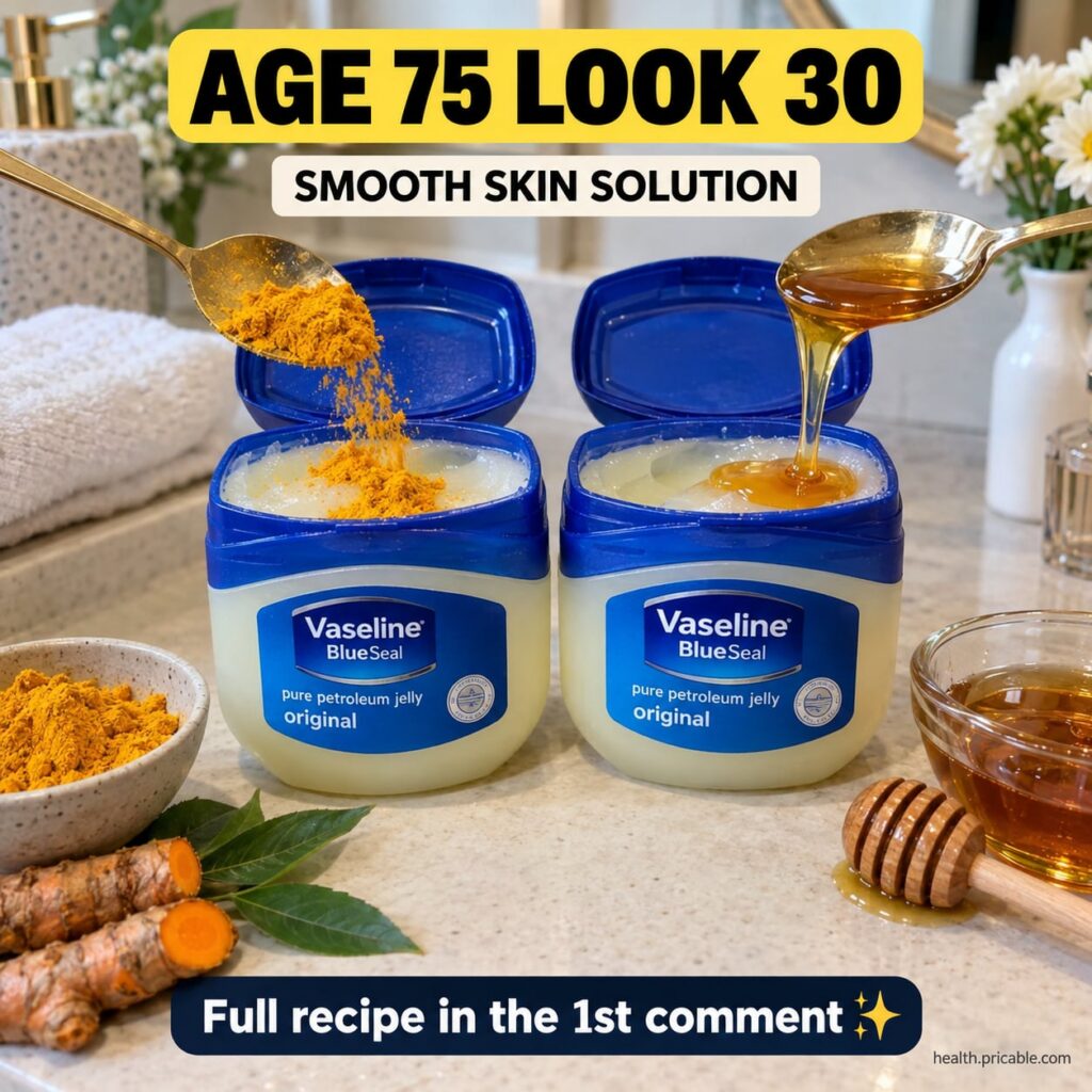 A small glass jar filled with a yellow-tinted creamy Vaseline-based mixture with a few fresh turmeric roots and a small 