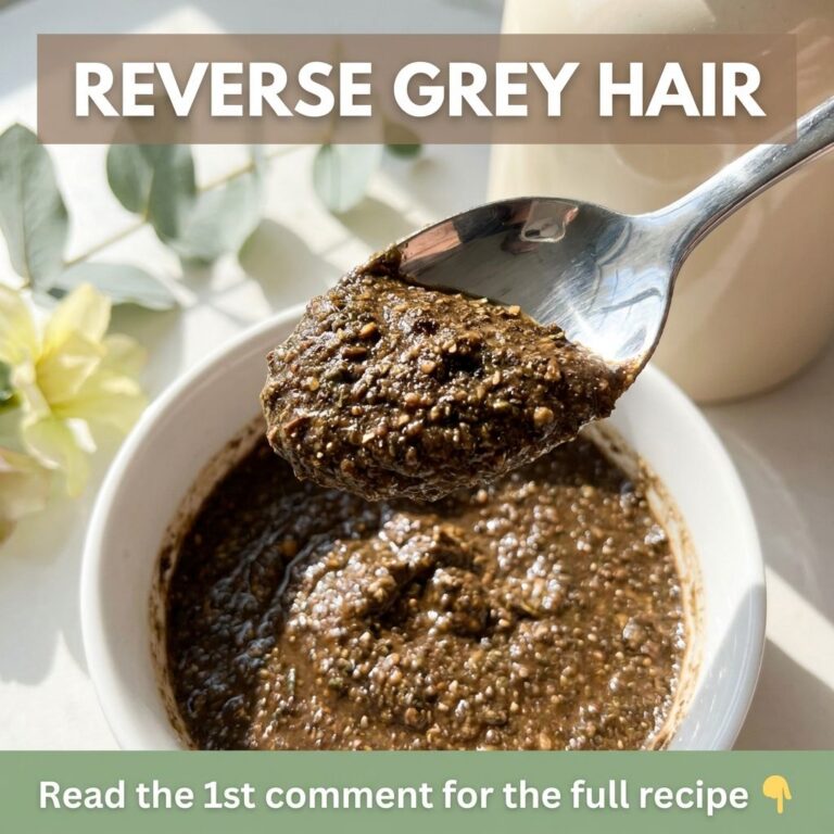 A close-up of a woman applying a natural dark-colored paste to her grey hair roots with gloved hands The background is s