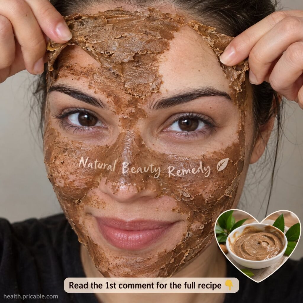 A woman gently applying a homemade face mask to her clean face with a soft glow effect on her skin
