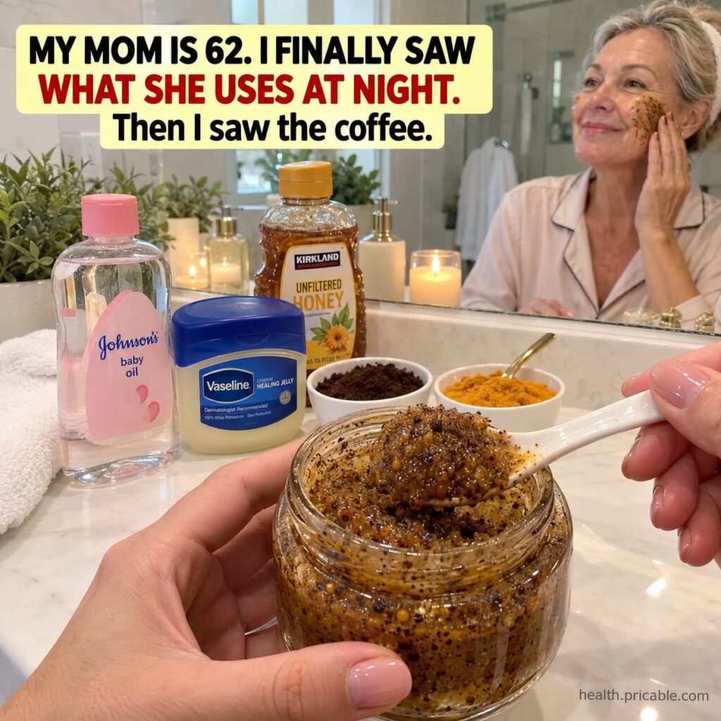 A close-up shot of the finished DIY coffee honey and turmeric scrub in a small glass jar showing its rich texture and na