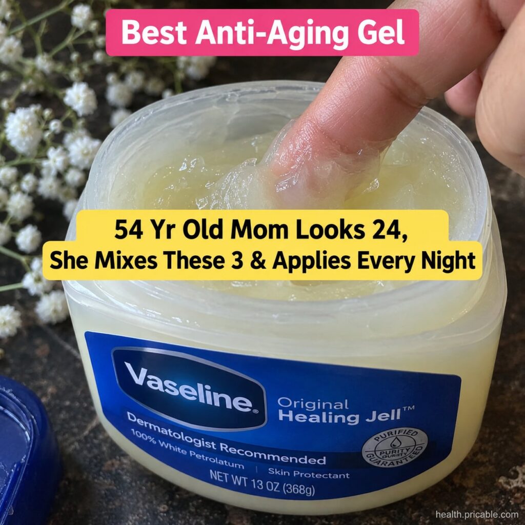 A small jar of petroleum jelly Vaseline next to a bottle of baby oil on a clean bathroom counter suggesting a DIY beauty