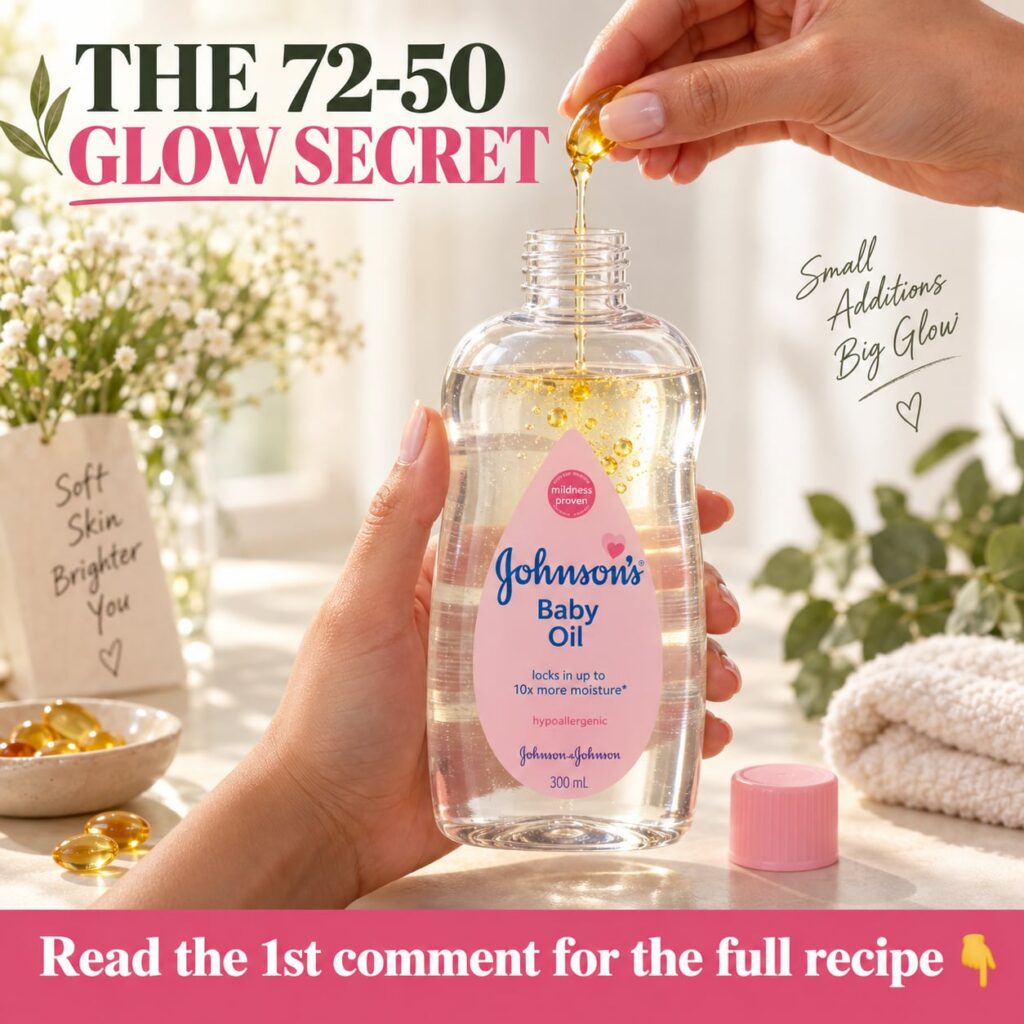 A bottle of Johnson s Baby Oil next to a small bottle of Vitamin E oil both placed on a light soft fabric with a subtle 