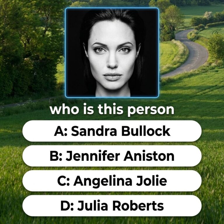 A headshot of a young Angelina Jolie from the 1990s perhaps from her role in Girl Interrupted with dark hair intense eye