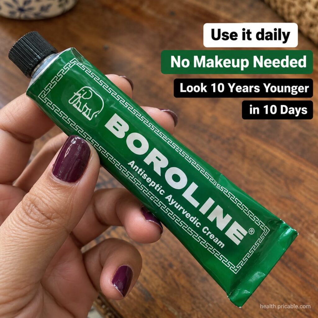 A tube of Boroline Antiseptic Ayurvedic Cream on a pristine white background with a soft glow emphasizing its traditiona