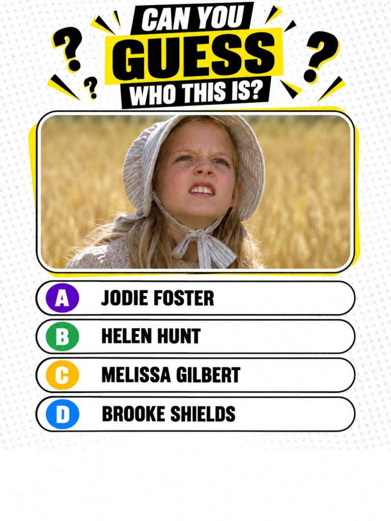 A young Melissa Gilbert as Laura Ingalls wearing a bonnet and a simple dress looking up with a thoughtful expression in 