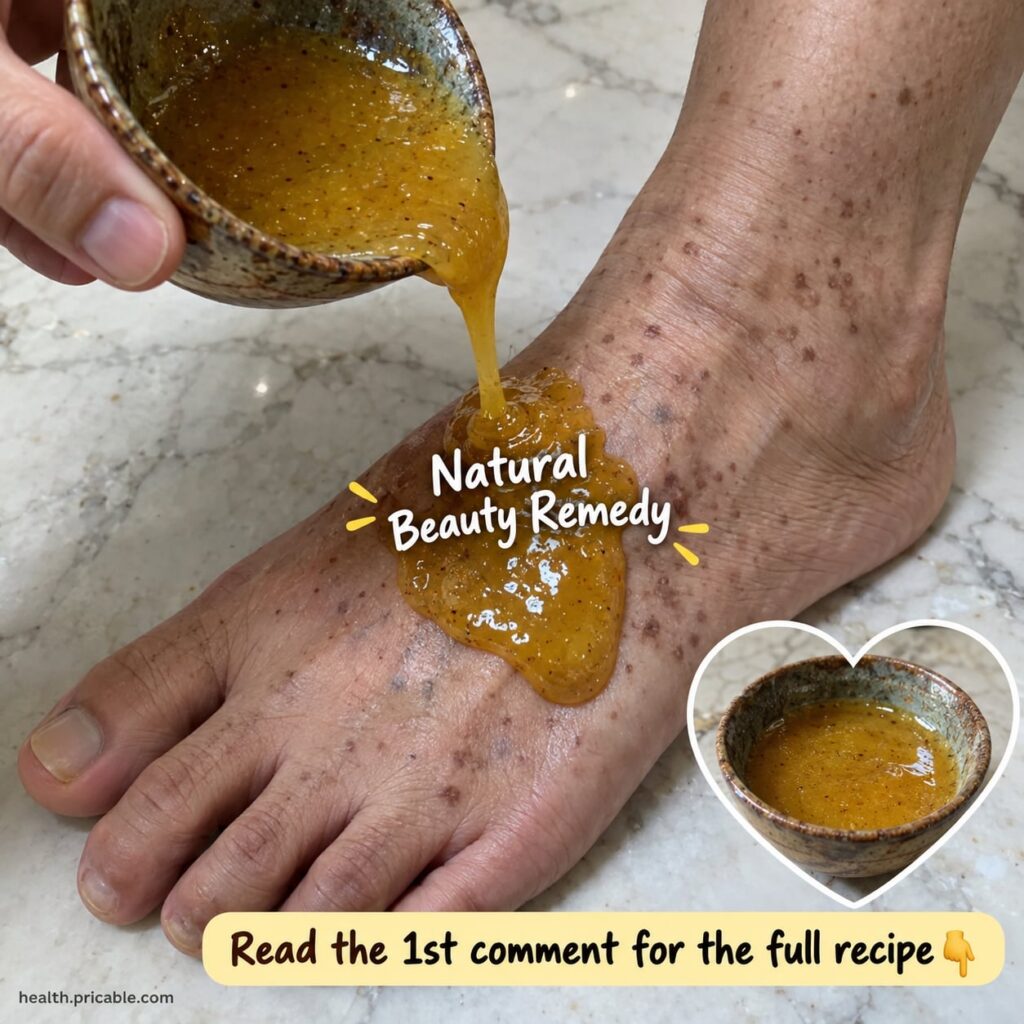 A small glass bowl filled with a shimmering golden liquid representing the foot peel set against a background of green t