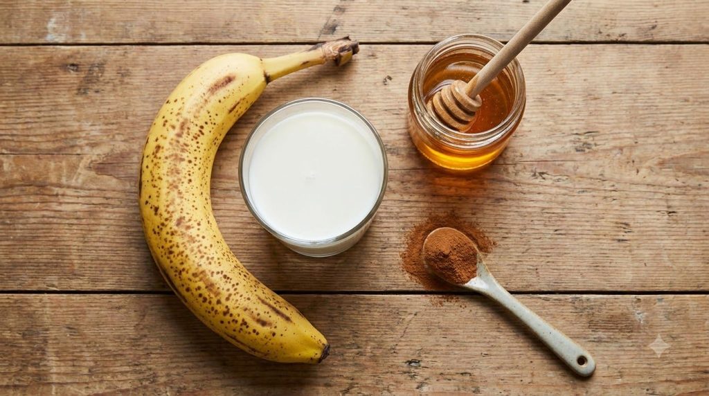 Ingredients for a banana smoothie laid out on a kitchen counter a ripe banana a glass of milk a jar of honey and a dash 