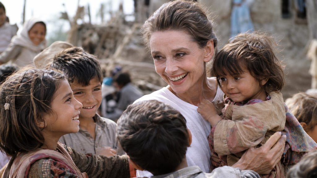 Audrey Hepburn engaging with children during her humanitarian work with UNICEF