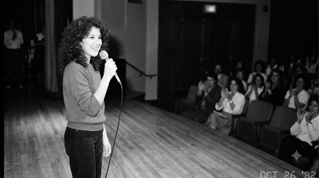 A young Celine Dion as a child or pre-teen holding a microphone