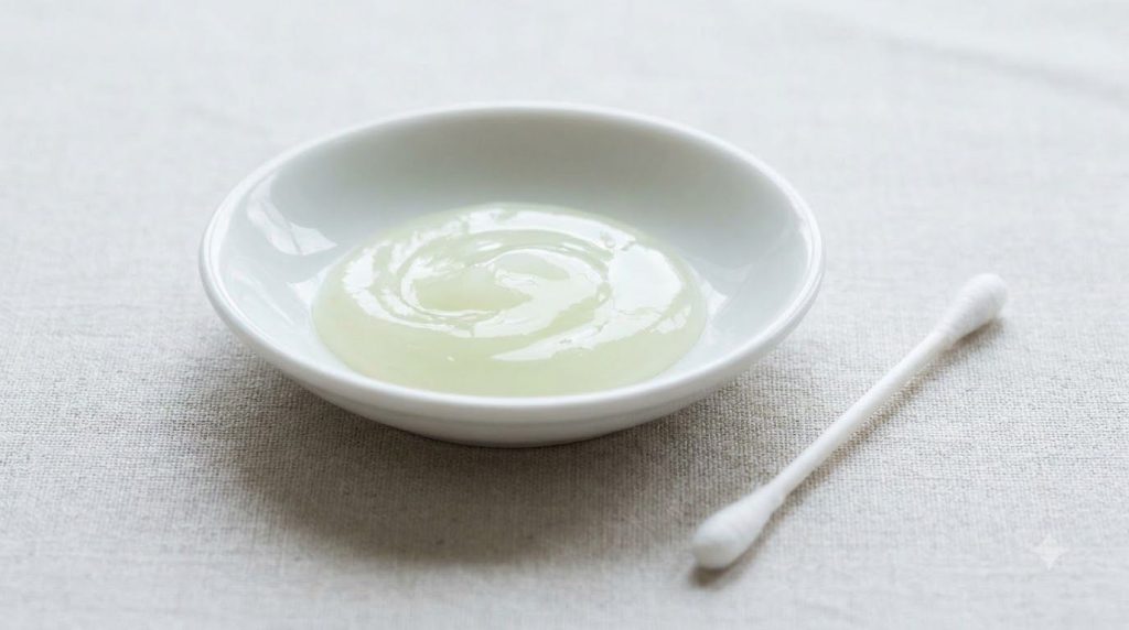 A small clean dish containing petroleum jelly mixed with a tiny amount of lime juice ready for application