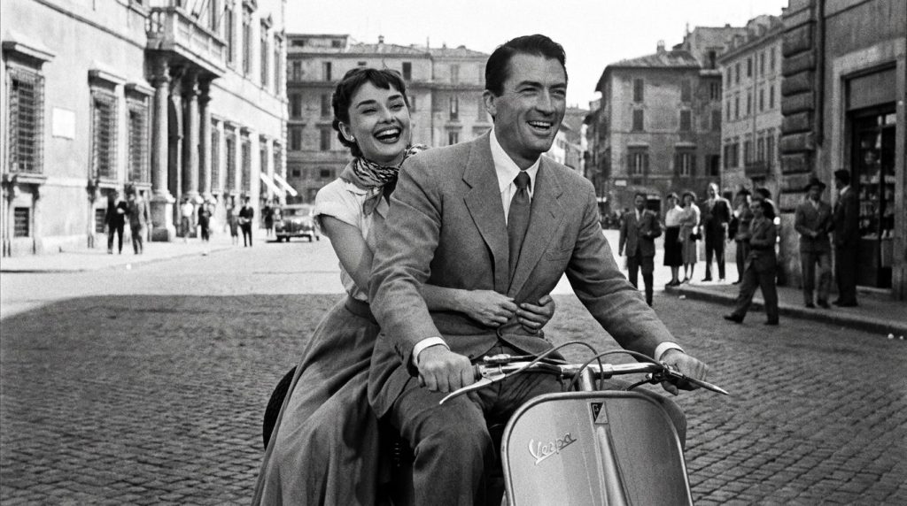A real film still or poster from one of Audrey Hepburn s iconic movies like Breakfast at Tiffany s My Fair Lady or Roman