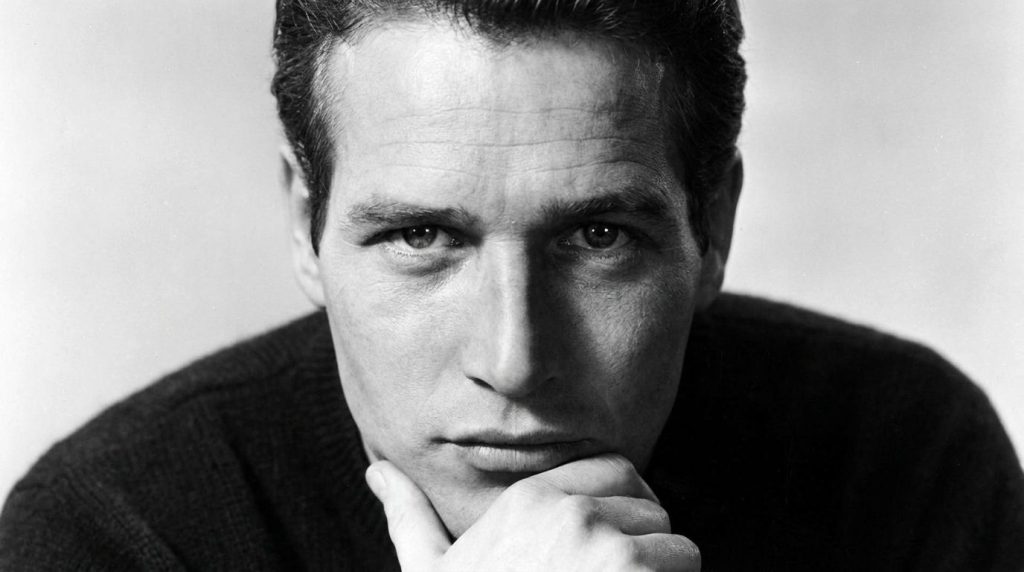 A black and white publicity photo of Paul Newman from his early career possibly from a film like Cool Hand Luke or The H