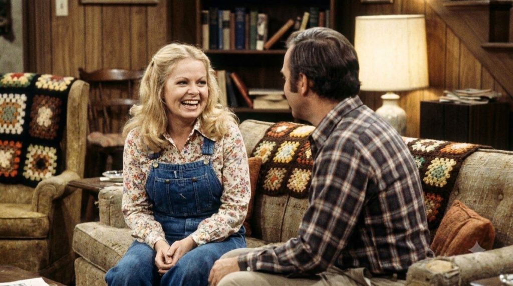 A real still photo of Sally Struthers as Gloria Stivic from All in the Family possibly with other cast members like Arch