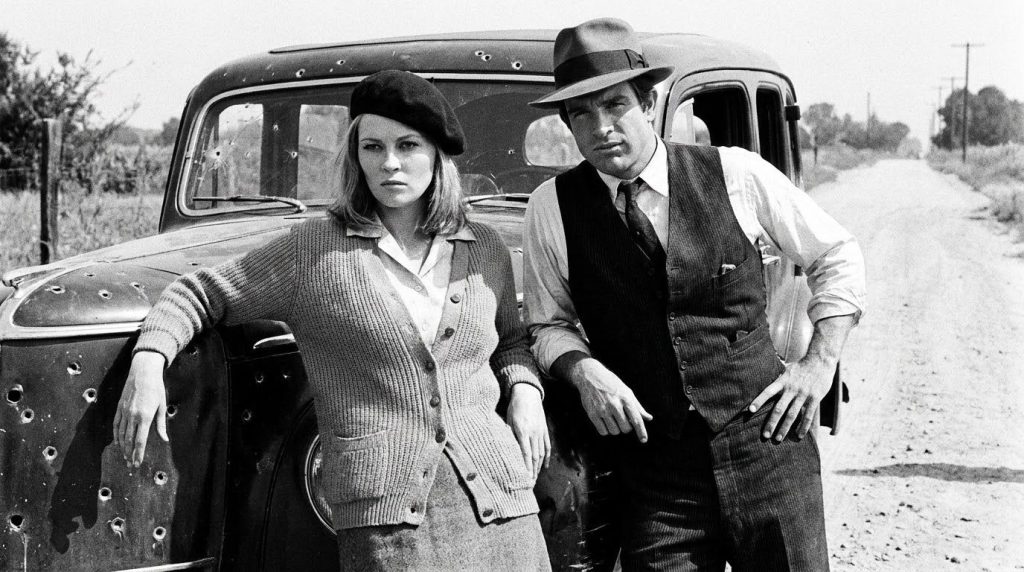 Faye Dunaway and Warren Beatty in a classic promotional photo for Bonnie and Clyde looking stylish and defiant