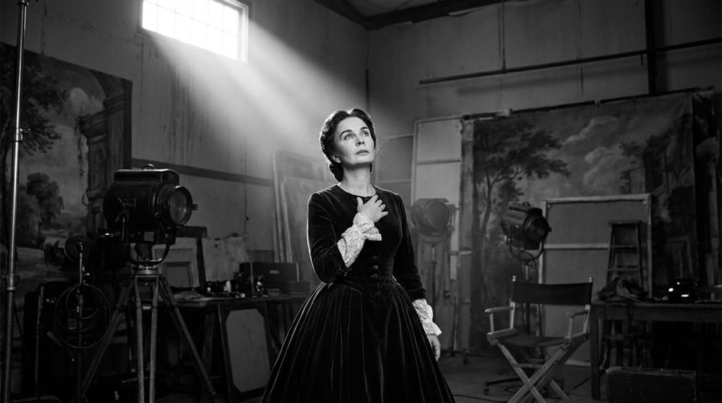 Jean Simmons in a dramatic pose from a classic Hollywood film perhaps a historical epic with elegant costume and strong 