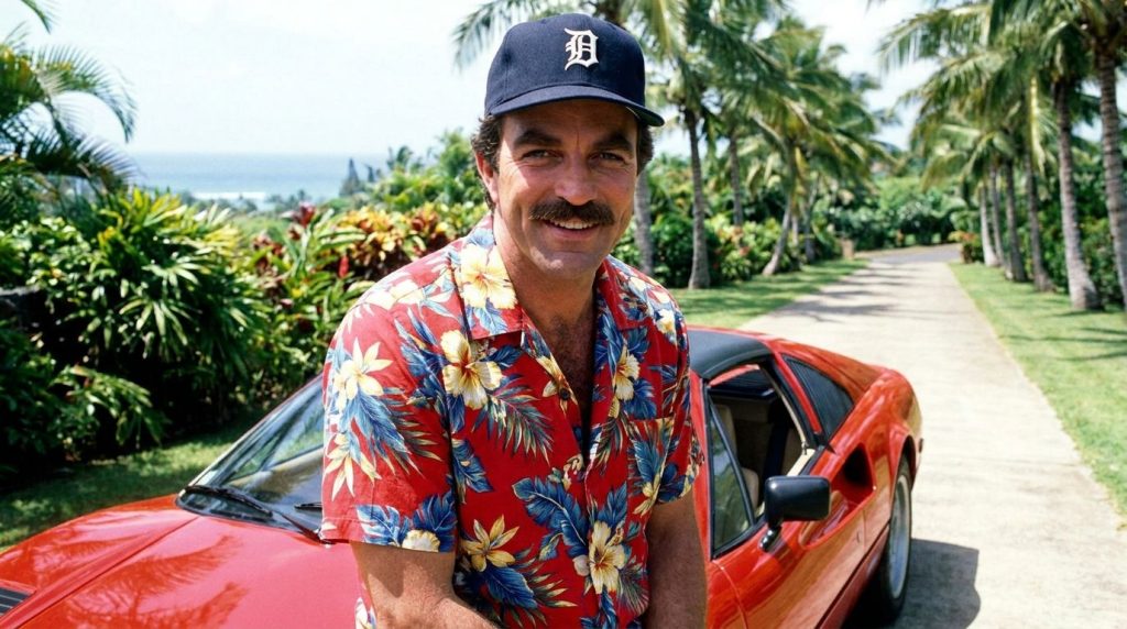 A portrait of Tom Selleck in character as Thomas Magnum wearing a Hawaiian shirt and a Detroit Tigers baseball cap with 