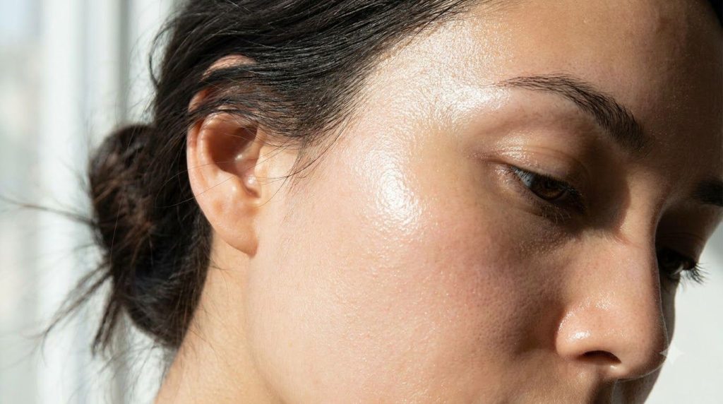Close-up of radiant glass skin complexion on a woman s face