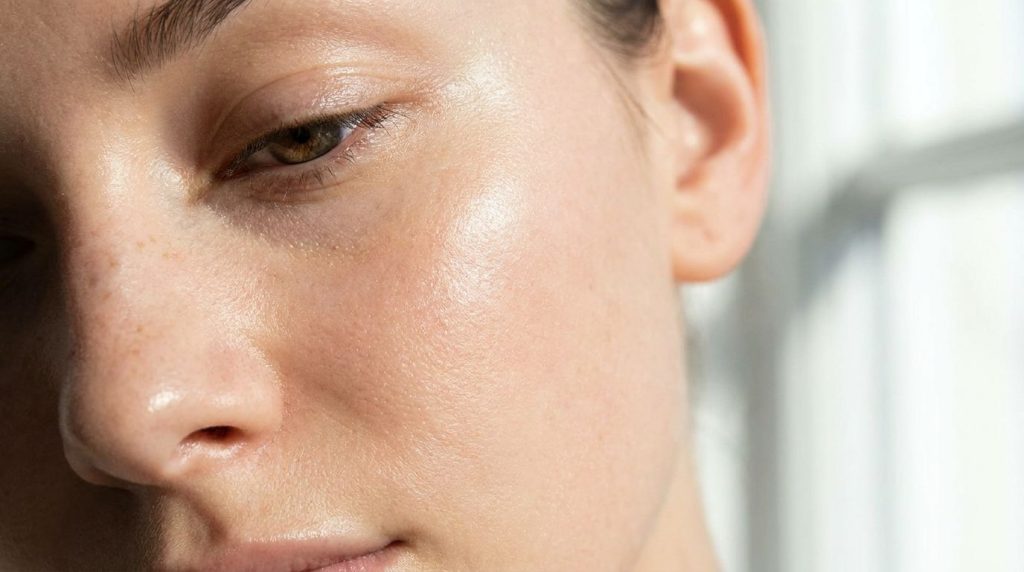 A close-up of healthy glowing skin on a woman s face after using a natural mask showing a smooth and radiant complexion