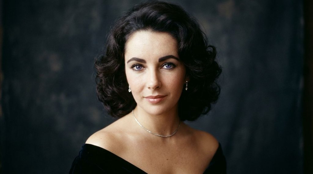 A real publicity photo of a young Elizabeth Taylor from her early career showcasing her famous violet eyes
