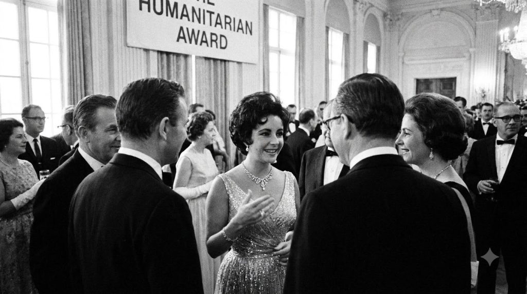 A real archival photo of Elizabeth Taylor engaged in humanitarian work or at an awards ceremony showing her elegant and