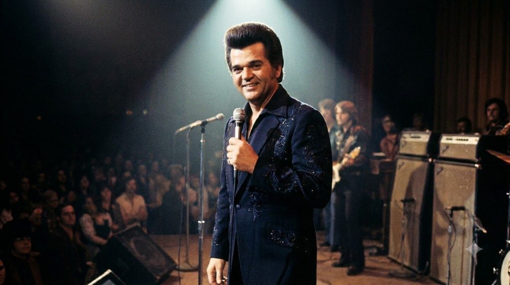 Conway Twitty performing on stage in the 1970s with his signature pompadour hairstyle