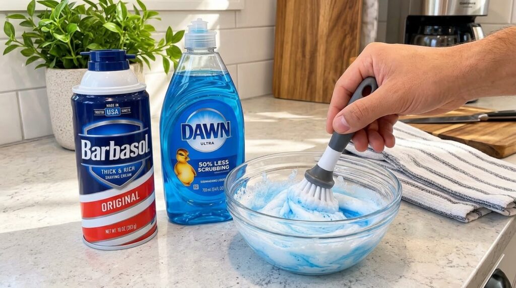 Close-up of hands mixing a blue and white foamy substance in a glass bowl with a brush with a can of shaving cream and a