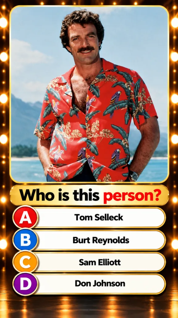 Tom Selleck in a red Hawaiian shirt with palm leaves and parrots smiling against a blue sky and ocean