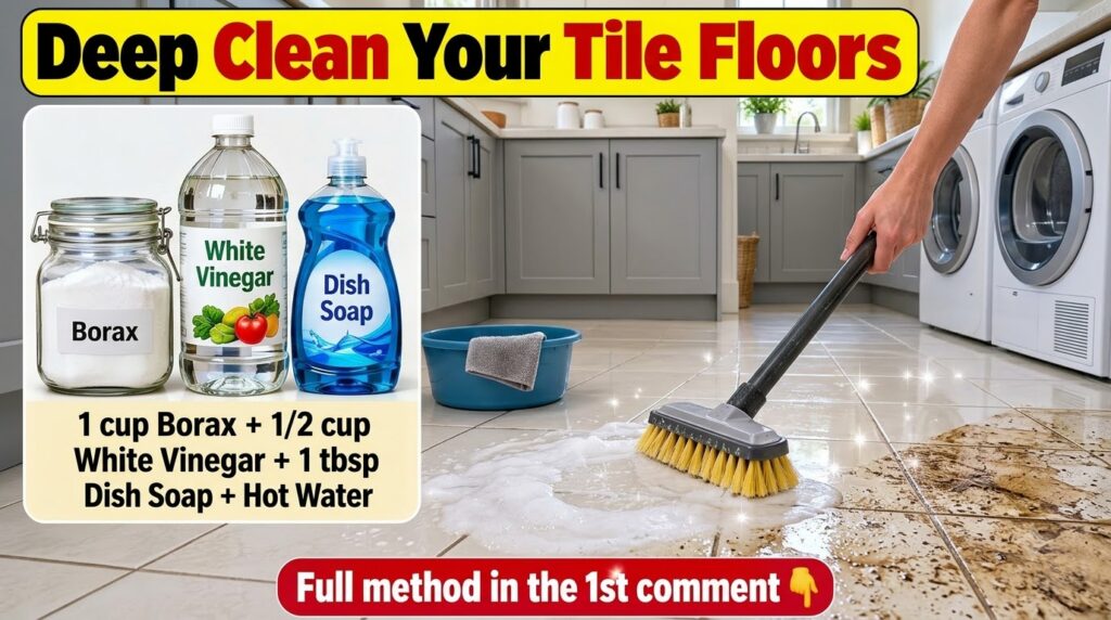 A person sweeping dirty foamy water across a tiled floor with a broom
