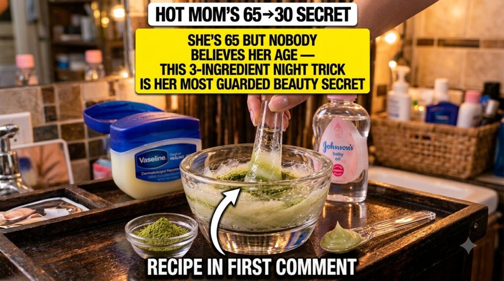 A hand mixing green tea powder into a creamy white substance in a glass bowl with Vaseline and Johnson s Baby Oil visibl