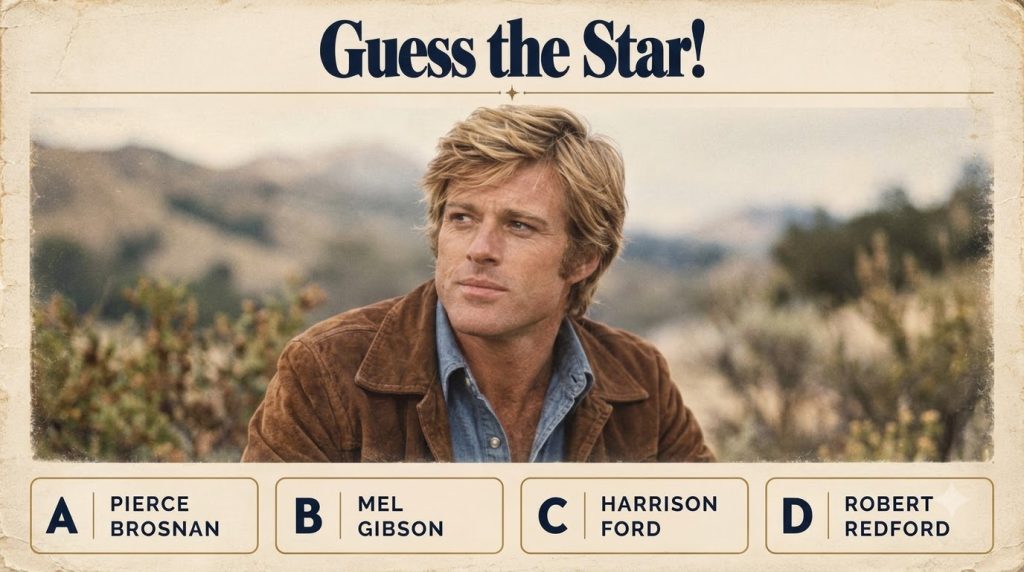 Portrait of a young Robert Redford with blonde hair wearing a brown jacket over a blue collared shirt with a calm expres