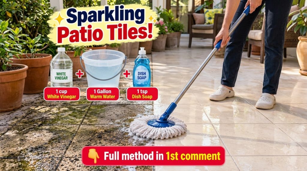 A playful light brown dog has its mouth around a white microfiber mop head on a wet tiled floor appearing to help with c