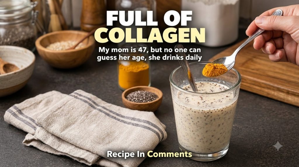 A glass of creamy yellow turmeric chia glow drink with a spoon of turmeric powder above it poised to drop its contents i