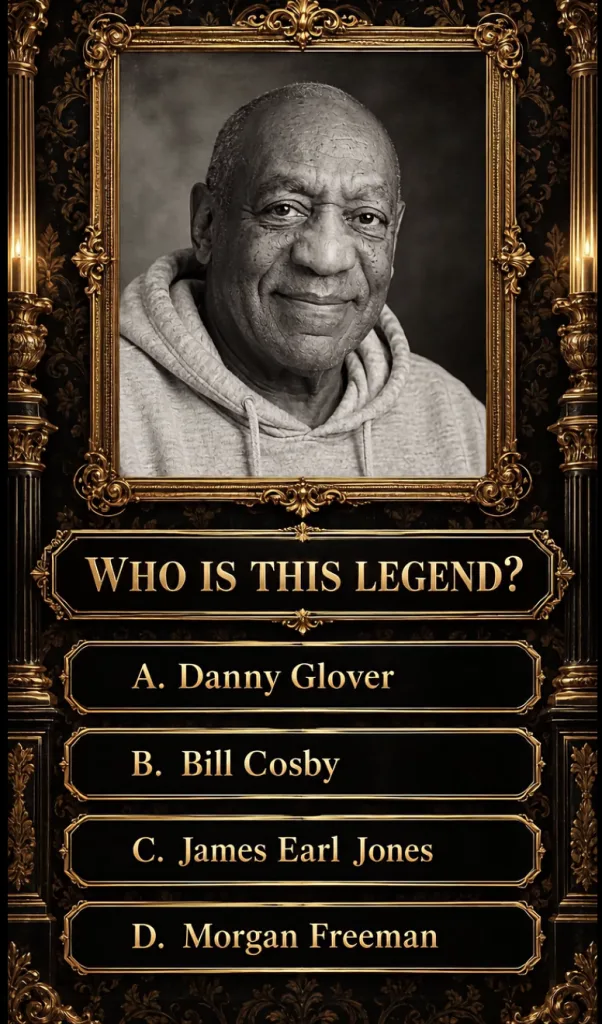 Black and white portrait of Bill Cosby in an ornate golden frame with a quiz question WHO IS THIS LEGEND below and answe