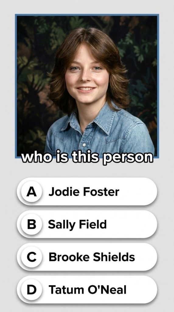 A young Jodie Foster in a cinematic serious pose reflecting her child star era in the 1970s with a subtle deep navy back