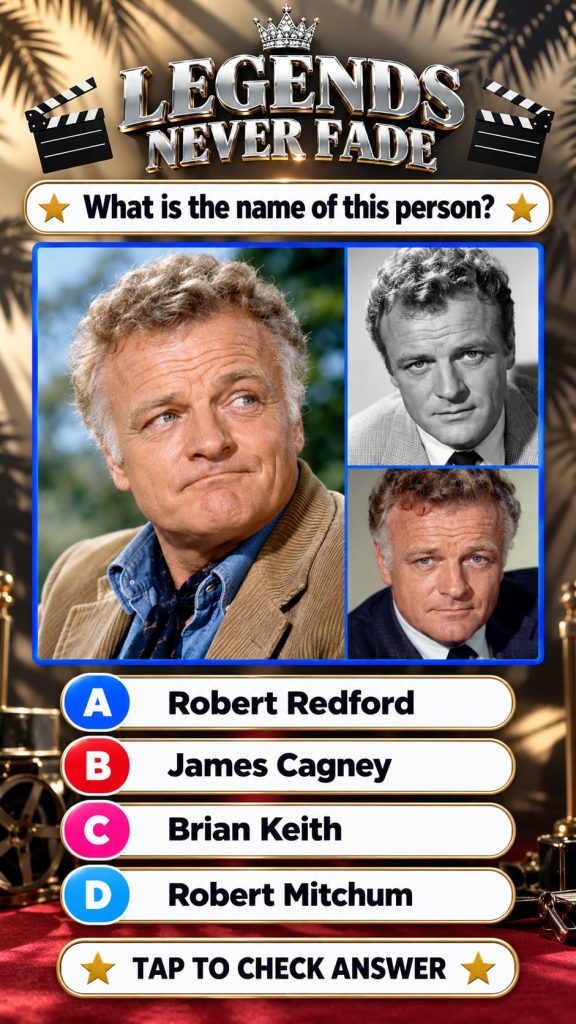 A striking elegant portrait of a classic Hollywood male actor from the Golden Age with a quizzical or slightly challengi