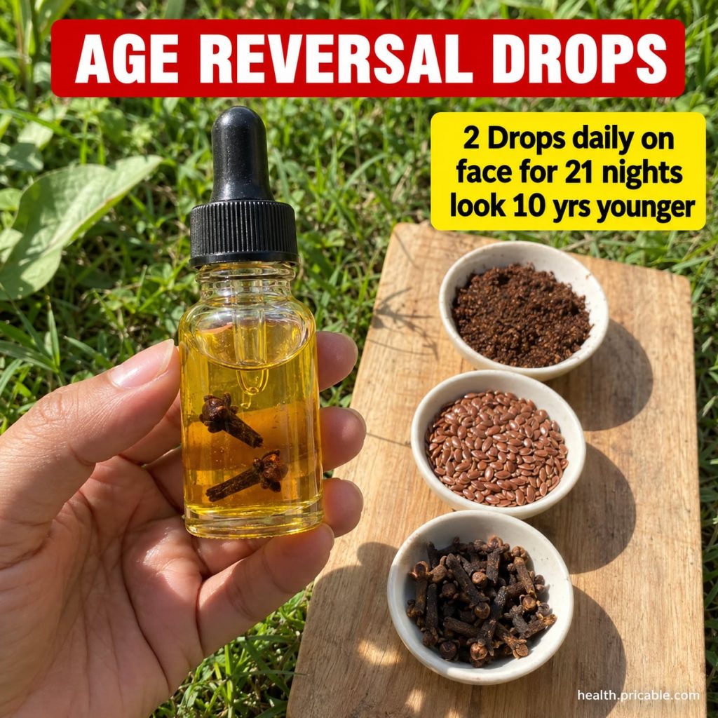A small glass dropper bottle filled with a golden clove-infused oil surrounded by whole dried cloves on a natural wooden