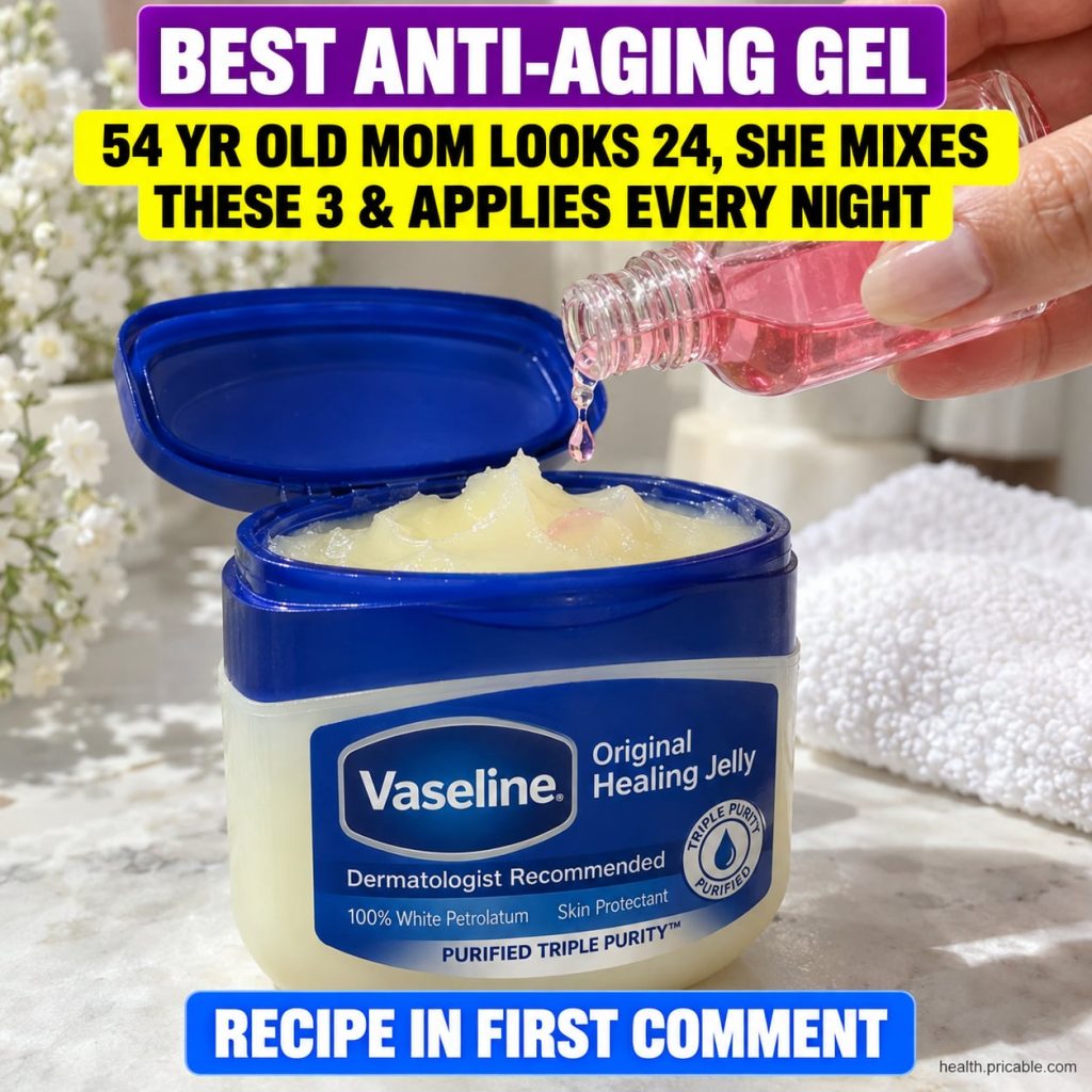 A small glass jar filled with a creamy white homemade anti-aging gel with a spoon beside it on a clean bathroom counter 